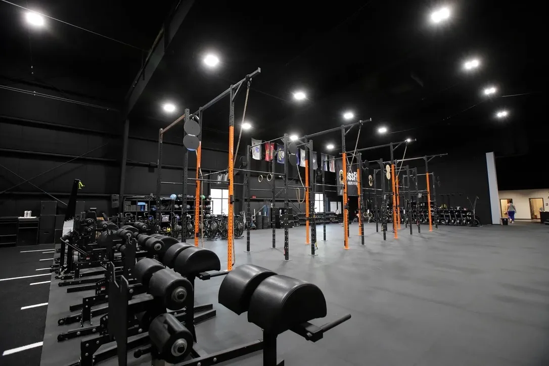 Wide view of Iron Forge training floor and rig